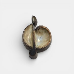 Two-tone brown-and-beige mid-century modern pottery dish marked "080".
